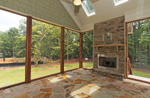 Large screened porch with fireplace and skylights