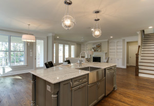 Kitchen with a large center island and view into family room