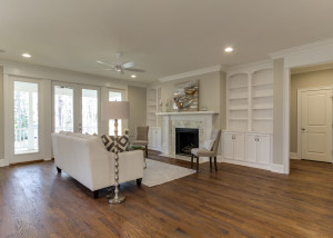 Family Room with fireplace and built in cabinets and shelves