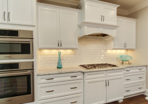 Large kitchen with view of oven and stove area